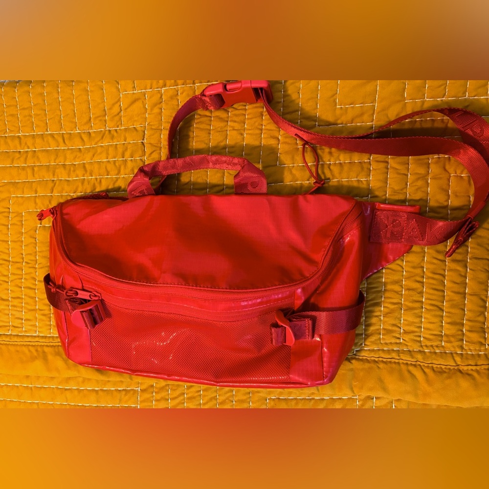 Calpak Terra Sling Crossbody Waist Bag Cherry Red Coated Ripstop.
